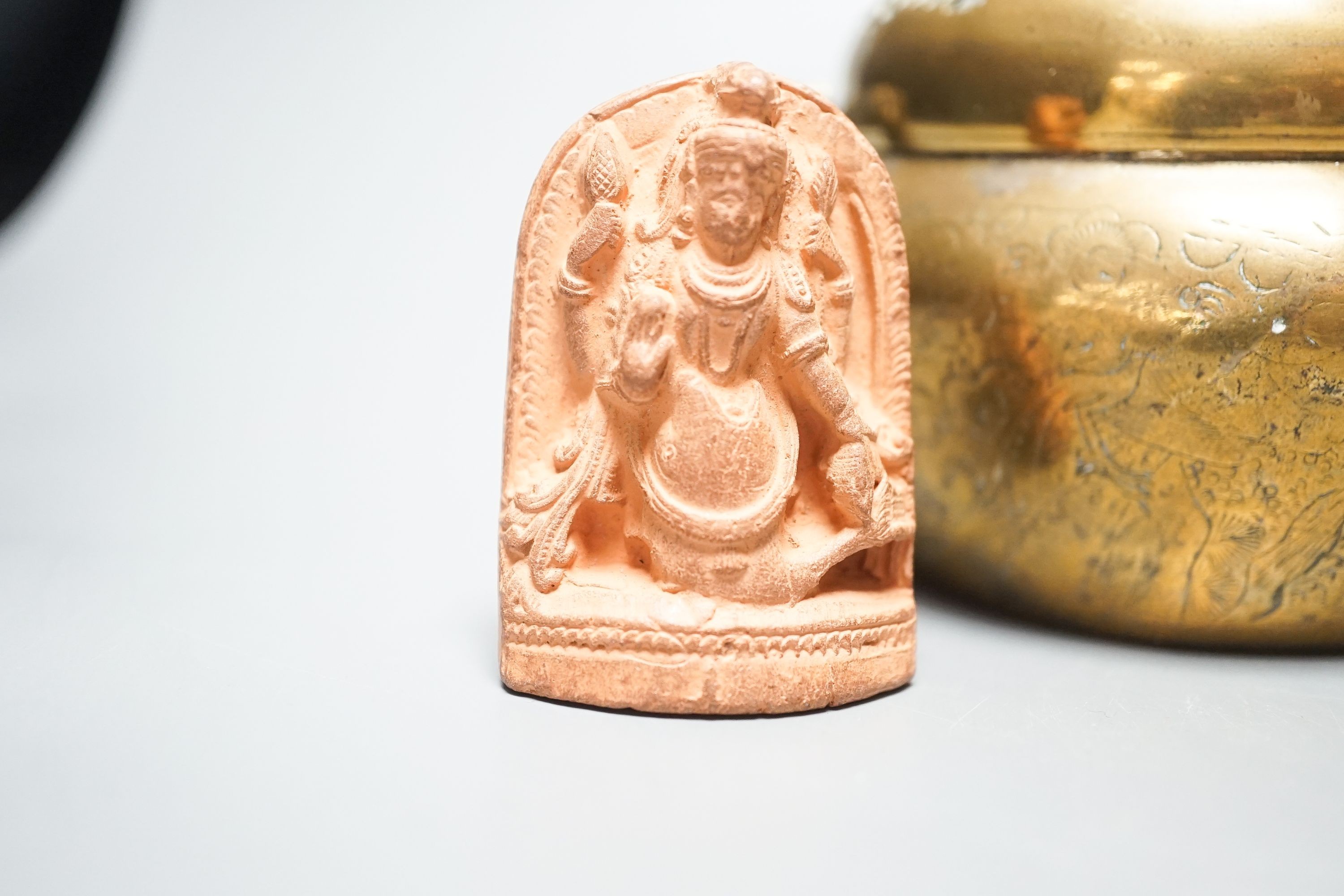 A bronze hand warmer with Xuande mark, 10 cm wide and two Himalayan Buddhist figures, tallest 6.8 cm (3)